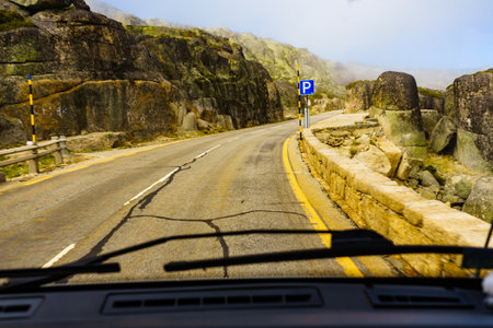 Asphalt road leading to Torre mountain peak of Serra da Estrela in Portugal.の写真素材