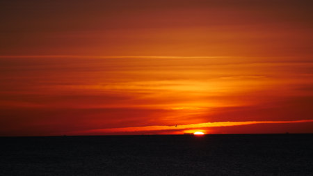 Sunrise over the sea. Sun rising above the horizon.の写真素材