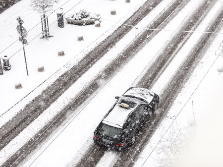 High angle shot of city street covered in white thick snow during winter weather.の写真素材
