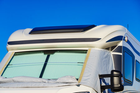 Camper with internal thermal screen blind at window pane. Camping on nature. Holidays and travel in motor home.の写真素材