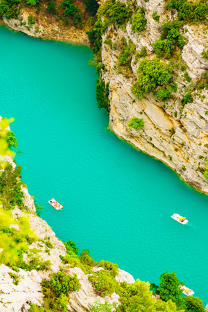Boats on turquoise water of St Croix Lake, Verdon Gorge in french Alps mountains, Provence France. Holidays trip.の写真素材