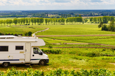 Camper rv visiting vineyard region. Pommard in Burgundy, Cote de Beaune, Cote d'Or, France. Summer holidays, trip attraction with mobile home.の写真素材