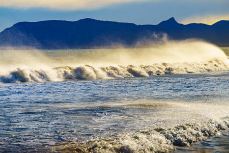 Seaside landscape. Sea waves forming white foam on sunny day. Beach seashore.の写真素材
