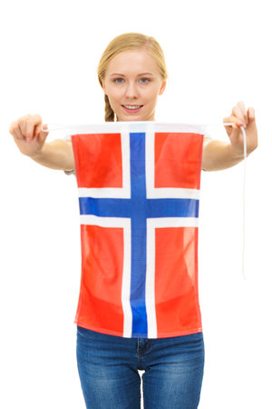 Blonde teenage girl holding Norwegian flag. Education, language learning.の写真素材