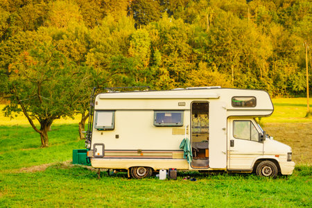 Camper vehicle camping on nature. Adventure, tour with motor home.の写真素材