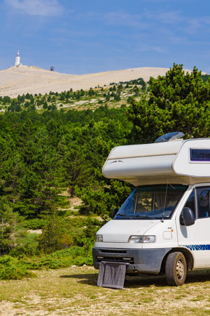 Caravan camping in mountains. Summit of Mont Ventoux in the distance. Travel attraction in Provence region, southern France.の写真素材