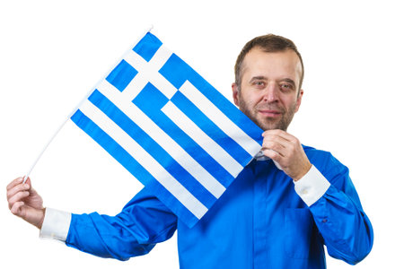 Happy joful man holding greek flag. Tourism, country presentation and promotion concept. Studio shot on white isolated background.の写真素材