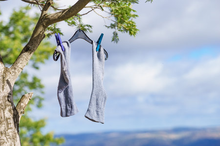 Clothes washing laundry hanging to dry outdoors. Camping on holidays tripの写真素材