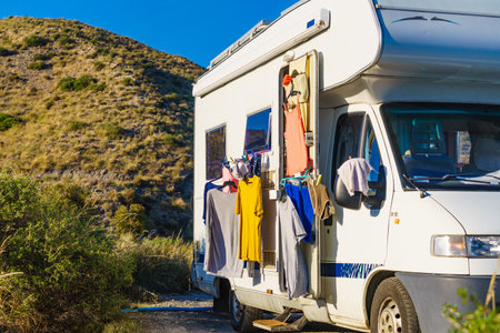 Clothes clean washing laundry hanging to dry on clothesline outdoor at caravan. Camping, holidays conceptの写真素材