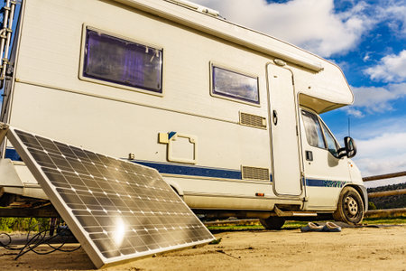Portable solar photovoltaic panel, charging battery at camper vehicle.の写真素材