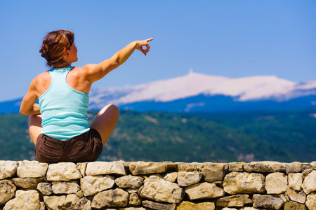 Tourist woman enjoying mountain view in Provence France. Mount Ventoux on the horizon.の写真素材