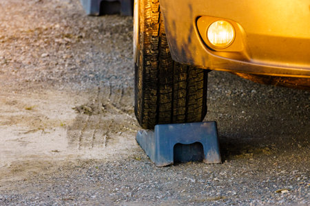 Caravan leveling block in use. Leveler ramp chock block for rv travel trailer. Accessories for motor home.の写真素材