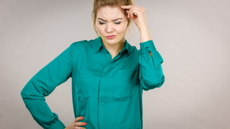 Young business woman wearing jacket intensive thinking finding great problem solution and ideas.の写真素材