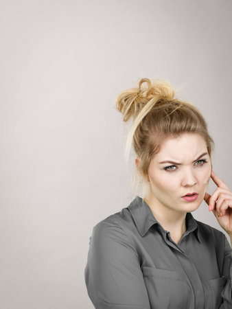 Young business woman wearing jacket intensive thinking finding great problem solution and ideas.の写真素材