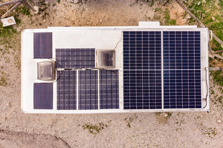 Caravan with solar panels on roof camping on nature. Aerial viewの写真素材