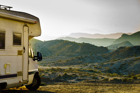 Caravan vehicle camping in Tabernas desert. Almeria province, Andalusia Spain. Traveling with mobile home.の写真素材
