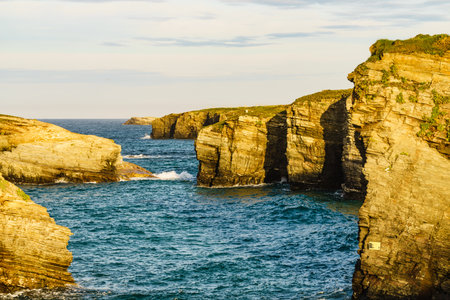 Cantabric sea at high tide, coastal landscape in northern Spain. Playa las Catedrales, Catedrais beach in Ribadeo, province of Lugo, Galicia.の写真素材