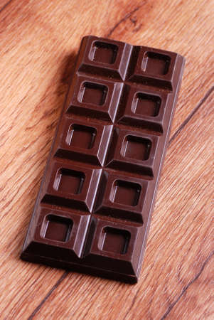 tablet chocolate with cocoa powder and hazelnutsの写真素材