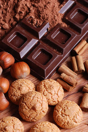 tablet chocolate with cocoa powder and hazelnutsの写真素材