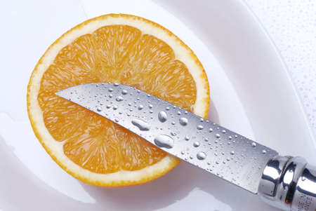orange cut with a knife wet