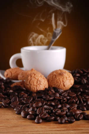 steaming espresso coffee in white cup for breakfastの写真素材