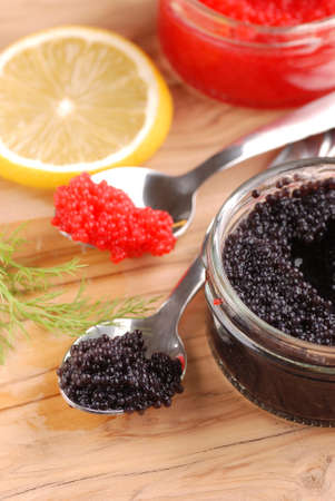 red and black lumpfish roe on  wooden tableの写真素材