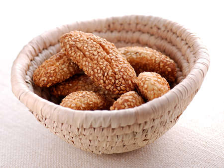 cookies with sesame seeds in small basketsの写真素材