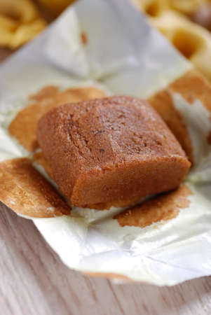 Bouillon cube in opened paper wrapping