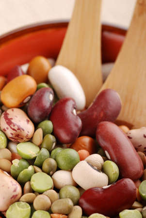 assorted vegetables in bowl with wooden spoon