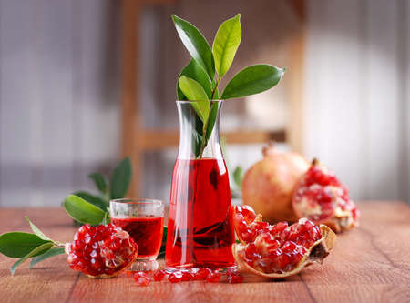 pomegranate juice with fruits on the tableの写真素材