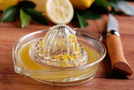 lemon juice with squeezer on the table