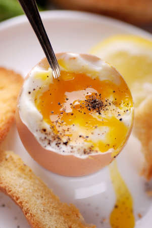 soft-boiled egg in egg cup for breakfastの写真素材