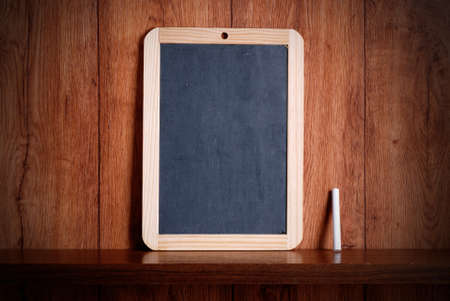 small blackboard on wooden shelfの写真素材