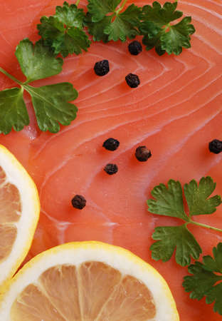 fresh salmon with lemon slicesの写真素材