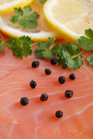 fresh salmon with lemon slicesの写真素材