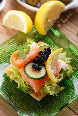 canapes with salmon and caviar with sliced zucchiniの写真素材