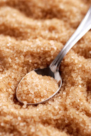 brown sugar in silver spoonの写真素材