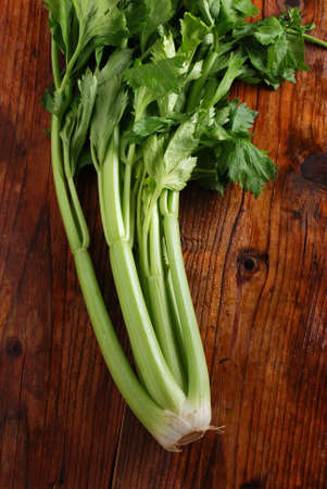 fresh green celery on wood tableの写真素材
