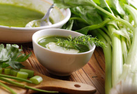 fresh celery soup in white bowlの写真素材
