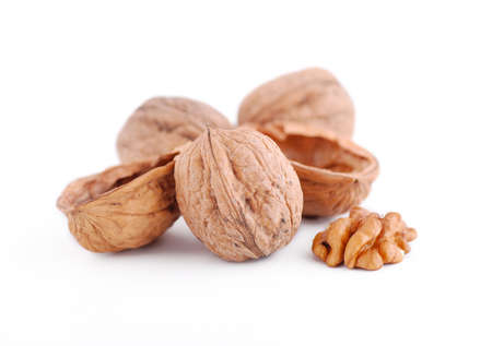 pile of walnuts on white background