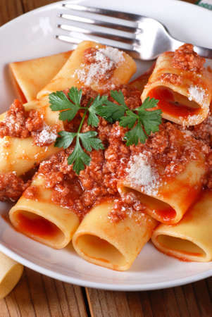Paccheri Neapolitans with meat sauce in the white dishの写真素材