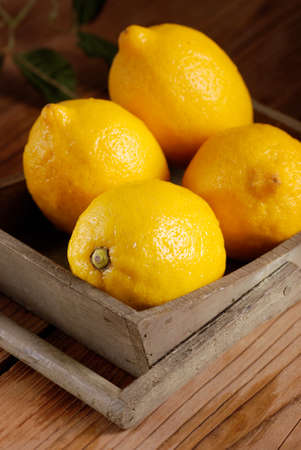yellow lemons of Sorrento organic on the wooden tableの写真素材