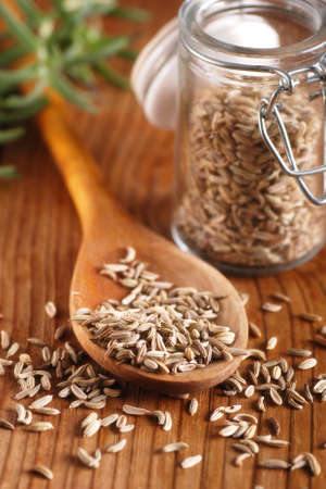 fennel seeds in wooden spoonの写真素材