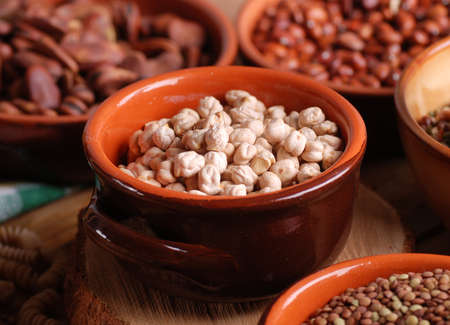 chickpeas in the bowl with other legumes aroundの写真素材