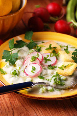 radish soup with asparagus decorated with parsley leavesの写真素材