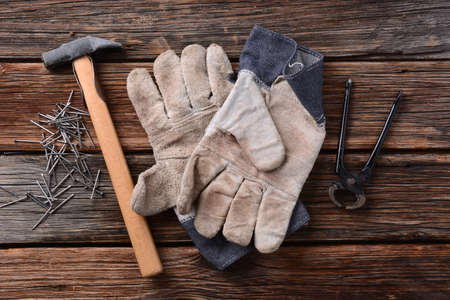 hammer, work gloves, pliers and nails - tools carpenterの写真素材
