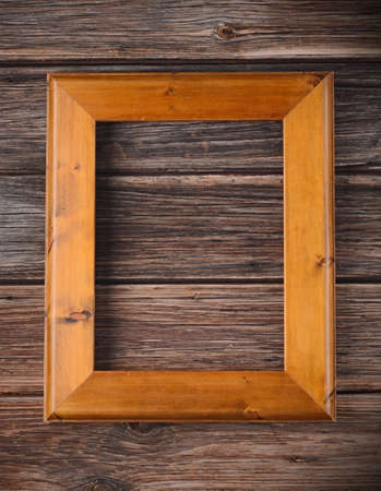 empty frame on wooden wallの写真素材