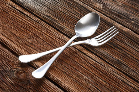 spoon and fork metal on wood table