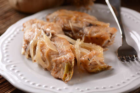 sweet and sour fish on white plate