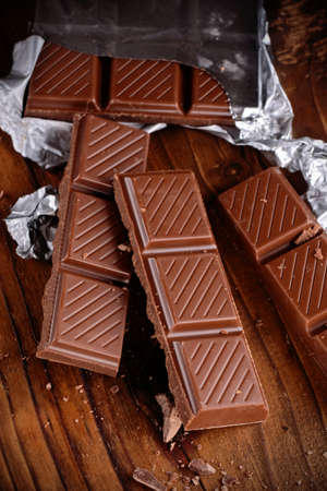 the chocolate bar on the wooden table
